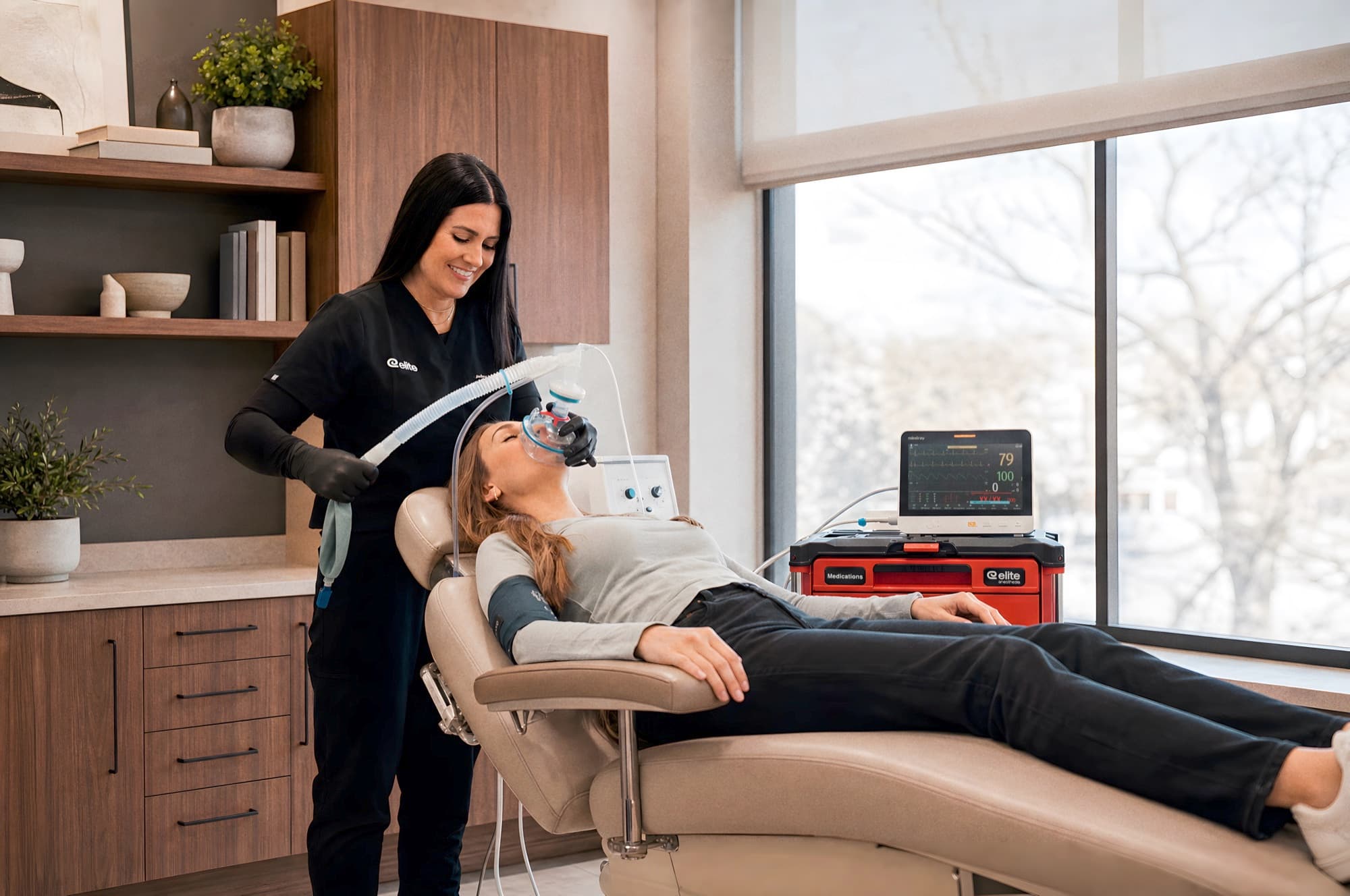 CRNA with a patient in a modern office