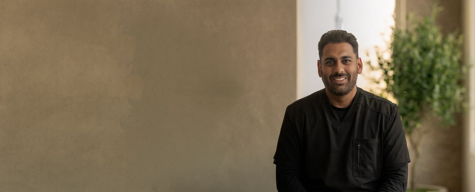 Dr. Kit Patel seated in his practice